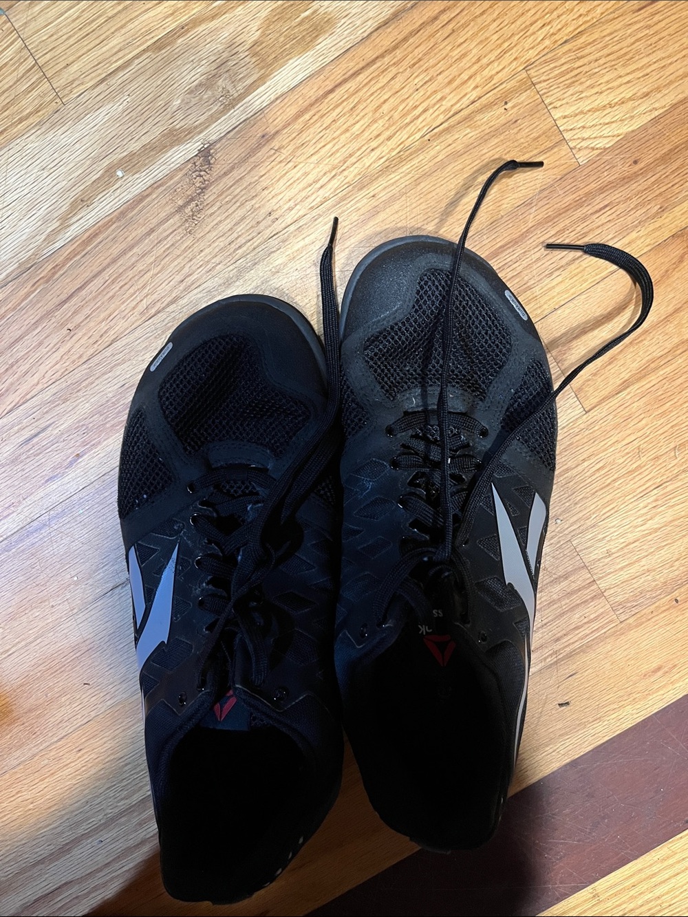 Reebok Men's Black Athletic Sneakers with Silver Logos